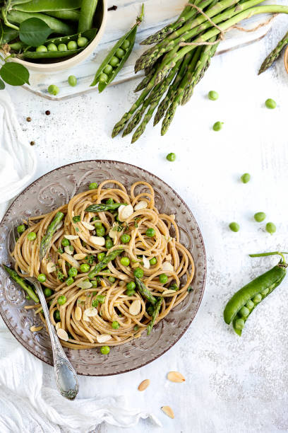 istock Spaghetti with fresh vegetables. Light image. Spring mood. Healthy food 958746938
