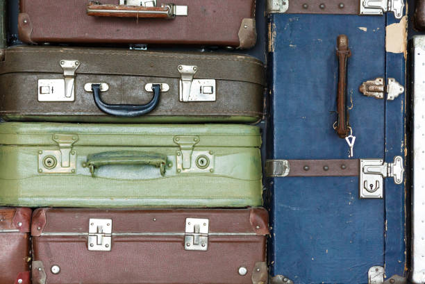 istock backdrop of wall of old suitcases 958747400