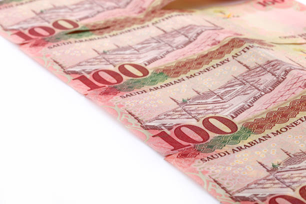 istock Saudi Arabia Hundred Riyal banknotes isolated on white background 958748336
