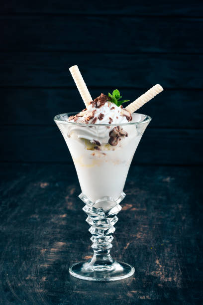 istock Creamy ice cream. On a black wooden background. Copy space. 958757480