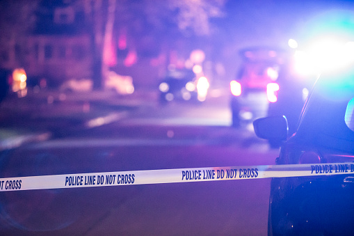 A crime scene in suburban Royal Oak, Michigan is marked off by police crime scene tape.