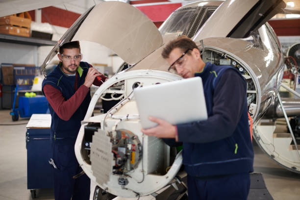 istock Aircraft mechanics in the hangar 958758852