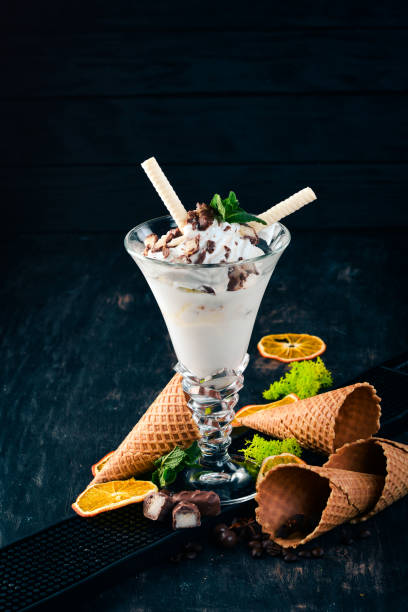 istock Creamy ice cream. On a black wooden background. Copy space. 958758856