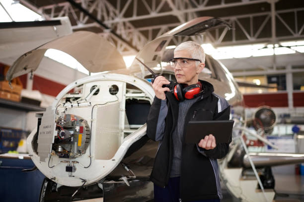 istock Aircraft mechnic in the hangar 958758884