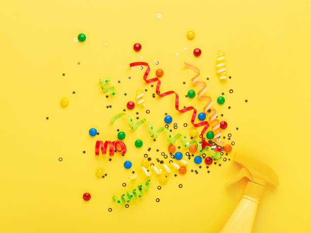 istock Party spray concept on yellow background. 958769740