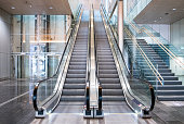 istock Modern luxury escalators with staircase 958770796