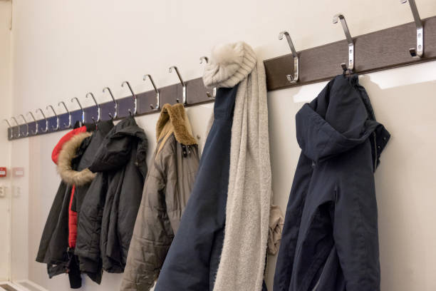 istock Winter jacket hanging on rack in deposit room 958770800