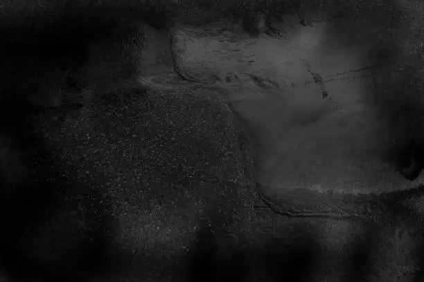 Photo of Black gray water surface background in grunge style.