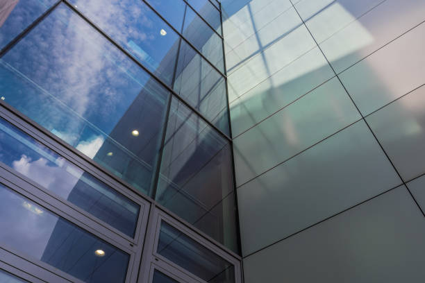 The glass architecture in city against a sky
