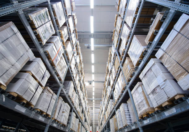 istock Rows of shelves with boxes in warehouse 958783554