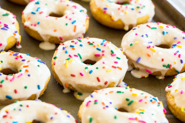 istock Close Up Cake Donuts With Icing and Sprinkles 958788364