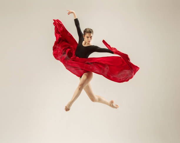 istock Modern ballet dancer dancing in full body on white studio background 958789952
