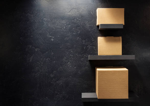 istock cardboard box on wooden shelf 958790020