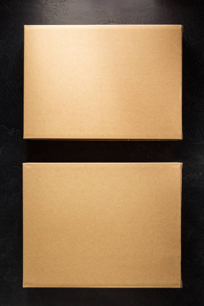 istock cardboard box on wooden shelf 958790056