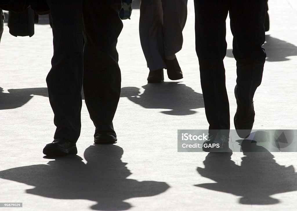 businessmen on their way to the office  In Silhouette Stock Photo