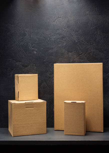 istock cardboard box on wooden shelf 958790638