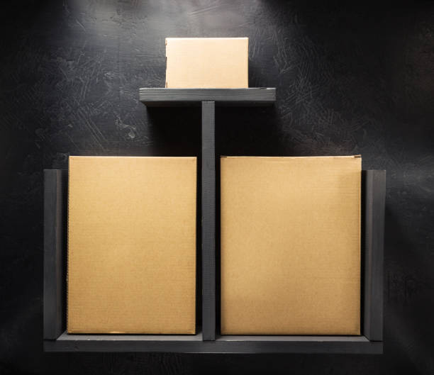 istock cardboard box on wooden shelf 958790644