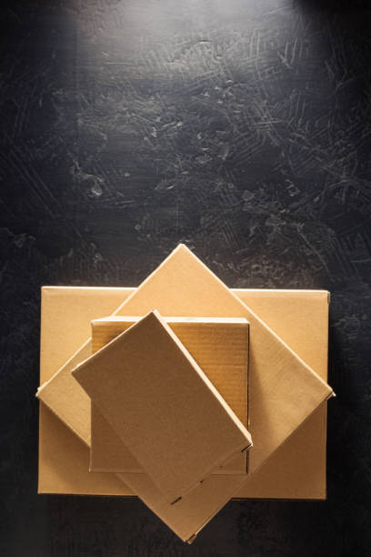 istock cardboard box on wooden shelf 958790878