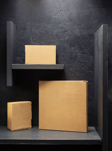 istock cardboard box on wooden shelf 958790890