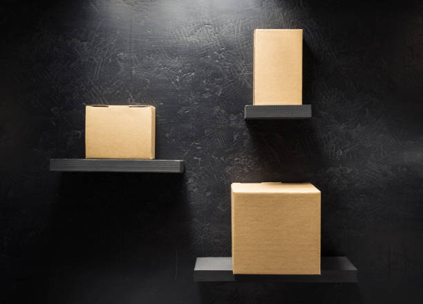 istock cardboard box on wooden shelf 958790924