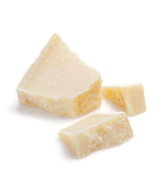 istock pieces of parmesan cheese on white background 958795602