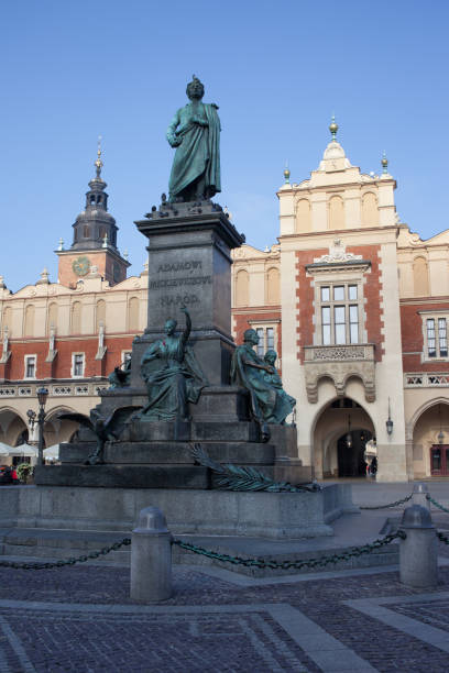 istock Adam Mickiewicz Monument and Cloth Hall in Krakow 958795988