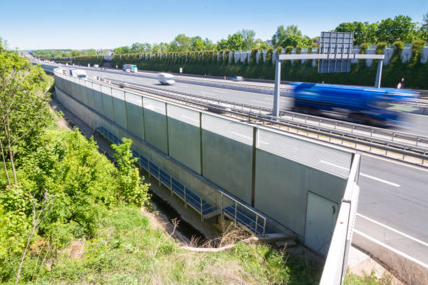 istock Noise protection wall on a highway 958796344