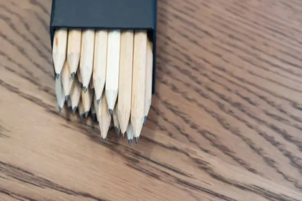 Pack of pencills on a wood table in the office