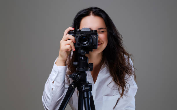 istock Female taking pictures with a professional photo camera. 958802206