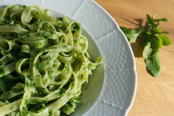 istock Pasta with rocket salad pesto sauce 958812356