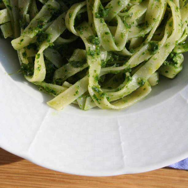 istock Pasta with rocket salad pesto sauce 958812806
