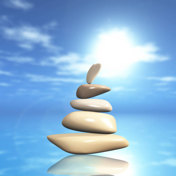 istock 3D balancing pebbles against a defocussed ocean background 958829724