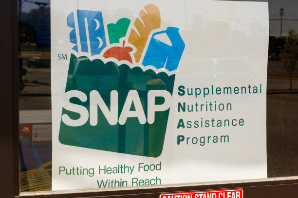 A Sign at a Retailer - We Accept SNAP IV stock photo