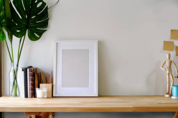 istock Mockup poster on wooden table with copy space. 958835484