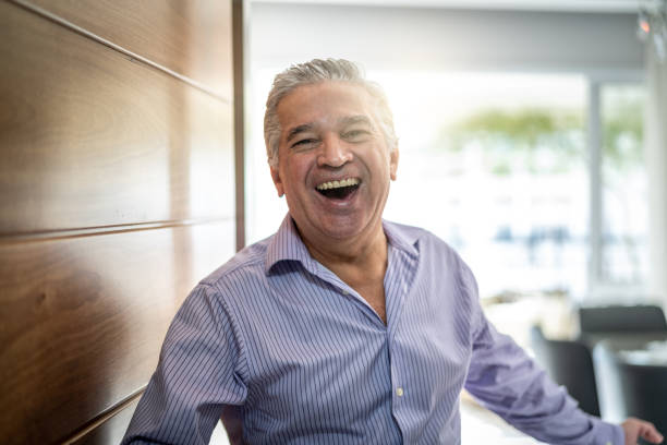 istock Mature Man Welcoming Home Opening His Front Door 958836178