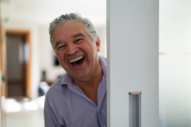 istock Mature Man Welcoming Home Opening His Front Door 958836258
