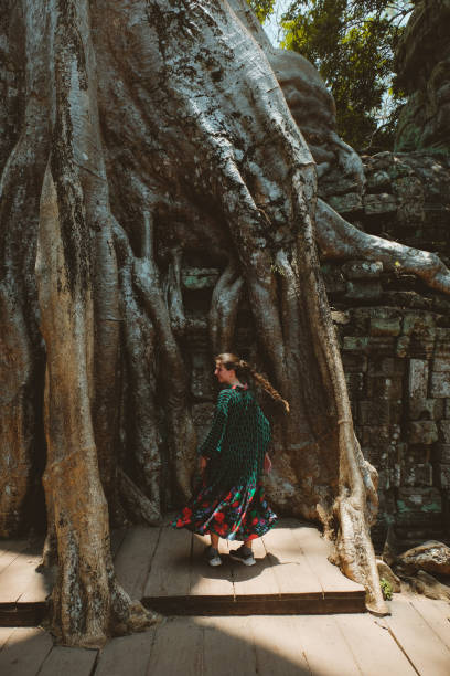 istock Woman in dress exploring Angkor in Cambodia 958840366