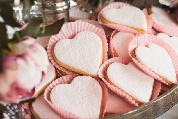 istock Heart shaped cookies with pink icing, closeup 958840536