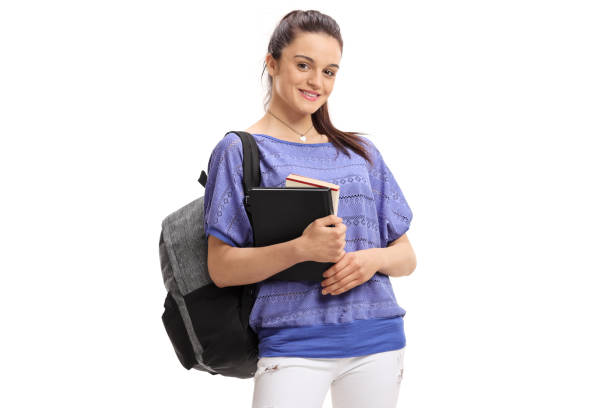 istock Female student with a backpack and books 958842142
