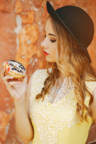 istock girl with donut 958852540