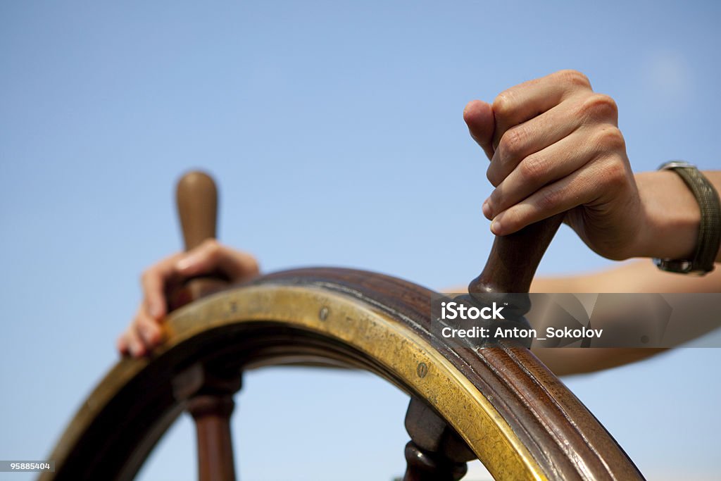 Hand on ship rudder. Steering Wheel Stock Photo Hand on ship rudder. Steering Wheel Stock Photo