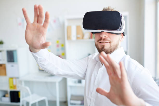istock Businessman in virtual glasses 958859182