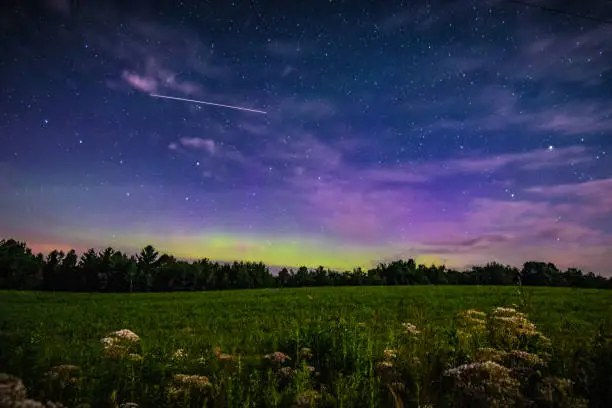 A beautiful array of light shines on the horizon as the Northern Lights light up a Wisconsin summer night.