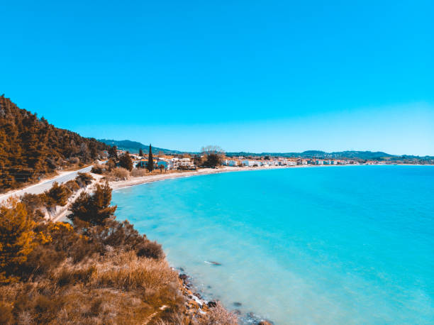 istock Pristine Mediterranean seaside township and road 958865252