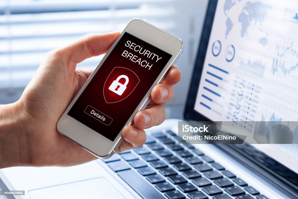 Security breach, smartphone screen, infected by internet virus, cyberattack hacking Security breach warning on smartphone screen, device infected by internet virus or malware after cyberattack by hacker, fraud alert with red padlock icon Computer Crime Stock Photo