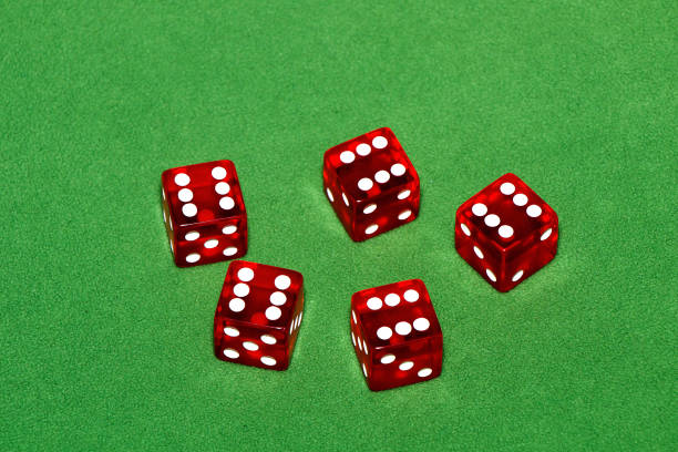 istock Casino. Red cubes on a green table 958868474