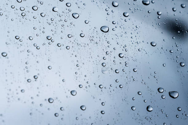 istock rain drops on clear glass, rain droplets 958872136