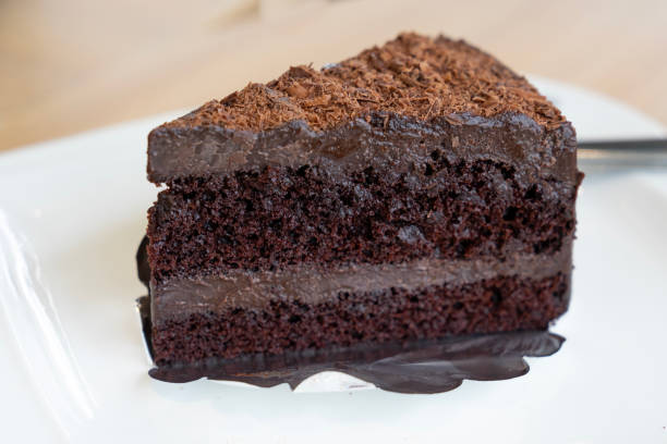 istock top view, slice of chocolate cake, layer chocolate fudge on withe plate 958872158
