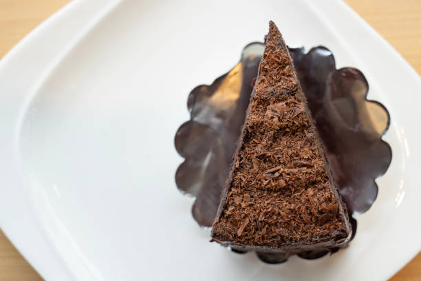 istock top view, slice of chocolate cake, layer chocolate fudge on withe plate 958872264