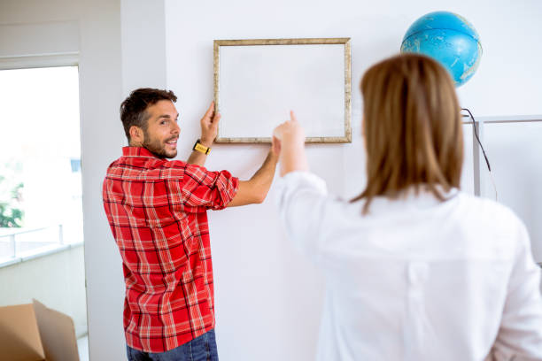 istock Couple decorateing New Home 958872320